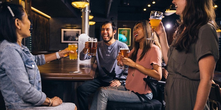 People having drinks at a sports bar