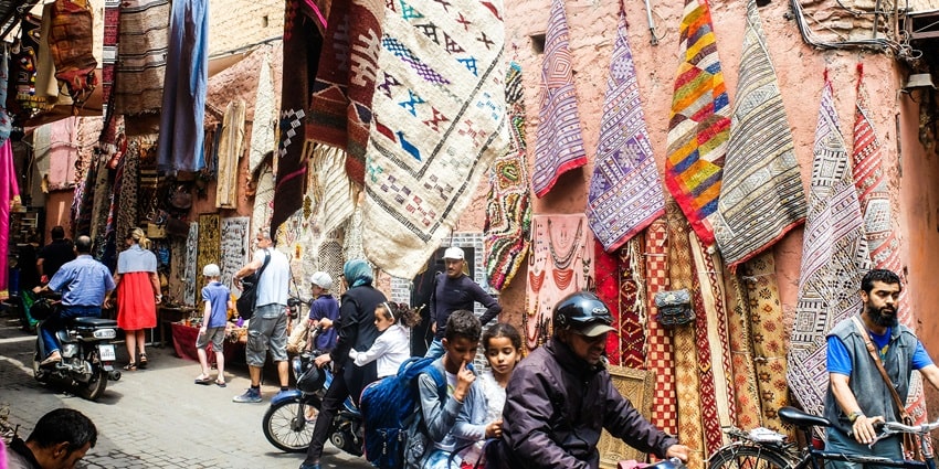 View of bustling market with people buying handcrafted products on the streets of Morocco