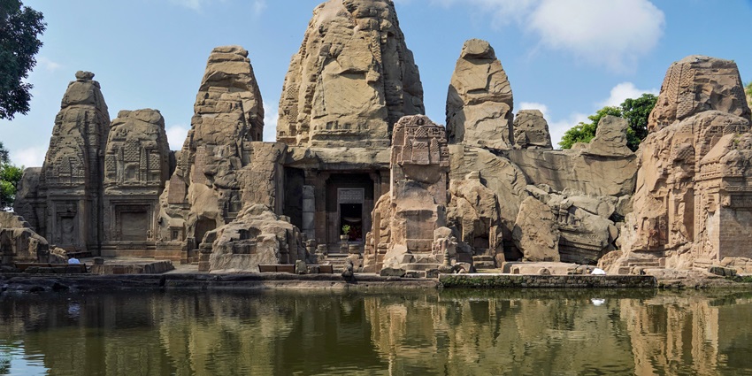 A picture of Masrur Temple or the rock-cut temple whose reflection can be seen in the water.