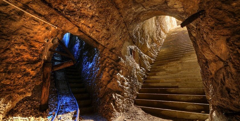 A picture of a cave system with 2 entrances and a big interior, clicked from the inside of the cave