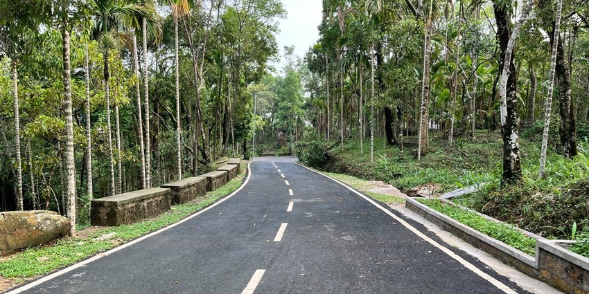 A breathtaking view of the lush green Mawlynnong Village during the day for travellers.