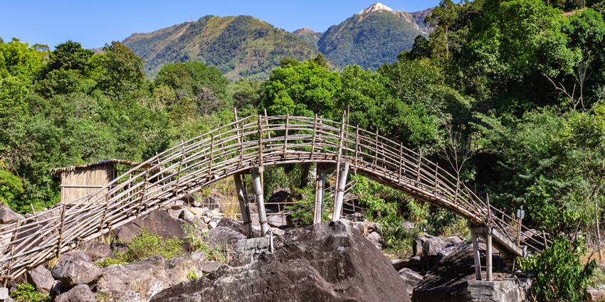 Image of a manmade bamboo bridge in Mawryngkhang for trekking adventure