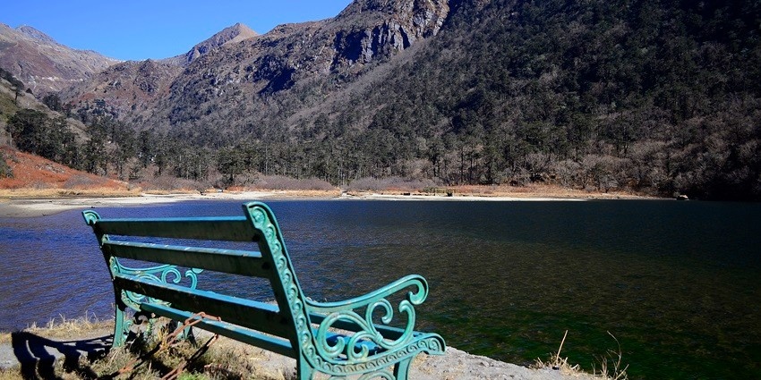 Mesmerising view of the Menmecho lake nestled amidst the verdant mountains