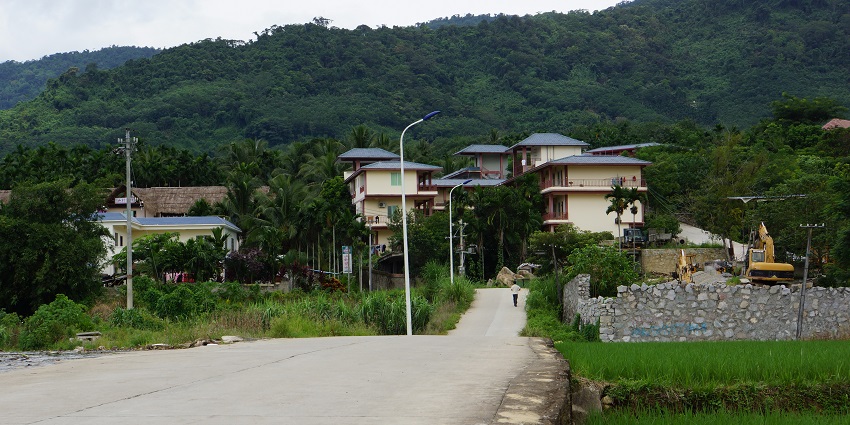 Beautiful picture of an enchanting village surrounded by the green lush forest and hills