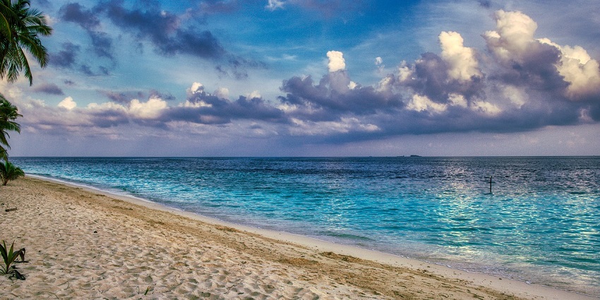 An image of an island offering exhilarating views where people can stroll around the shore.