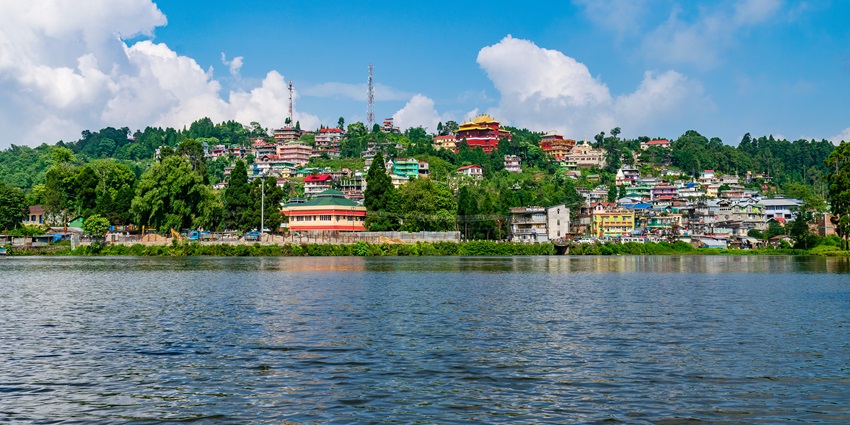 A serene view of the Mirik Lake featuring shimmering blue waters and more.