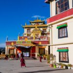 A breathtaking view of a monastery in Shimla with colourful architecture during the day.