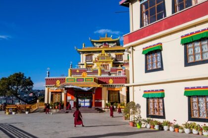 A breathtaking view of a monastery in Shimla with colourful architecture during the day.