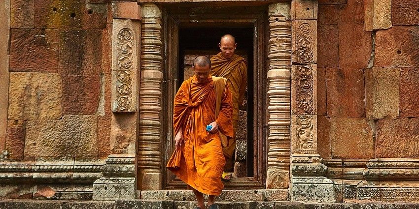 Snpashoit of the two monks wearing the saffron robe coming out of the temple premises