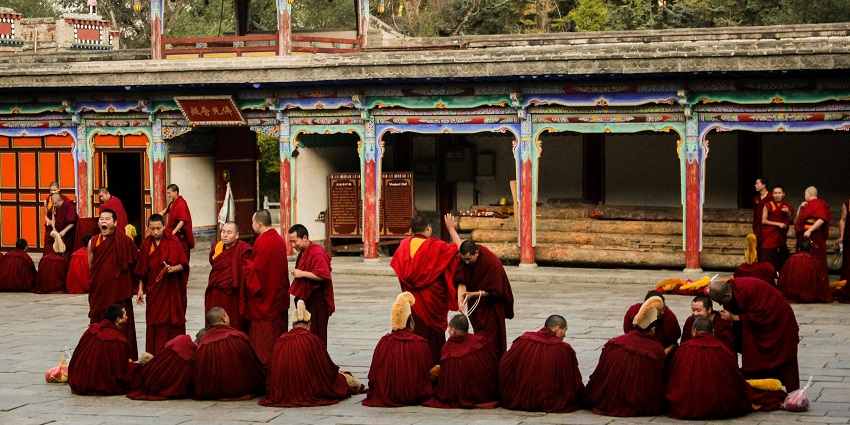 Monks wearing red robes - Chongkham is one of the best places to visit in Namsai.