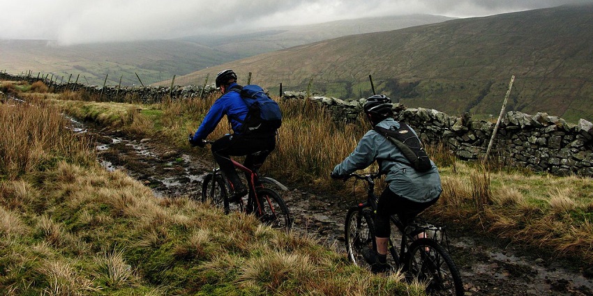 Mountain biking provides a range of experiences, from gentle downhill rides to challenging uphill climbs.