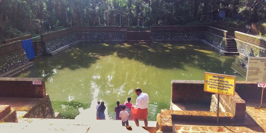 Take a dip in the holy pond of the famous Mridanga Saileswari Temple in Kerala.