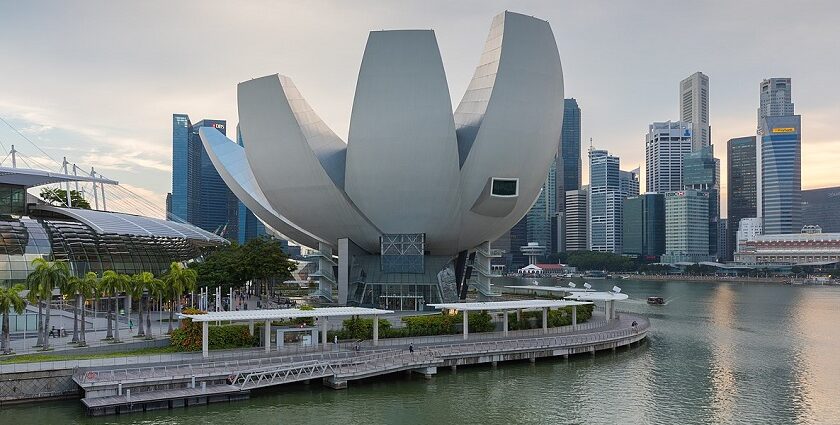 A drone shot of the front view of museum taken at the late afternoon, in front of the skyline.