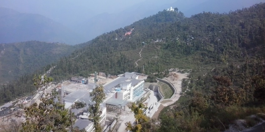 An aerial picture of the Mussoorie city with views of the scenic hills and lush greenery