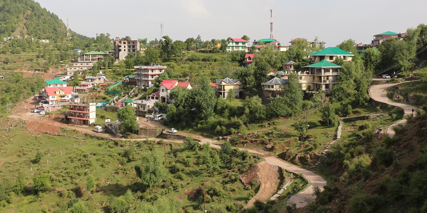 A captivating view of the Naddi Village, with lush greenery, in Himachal Pradesh.