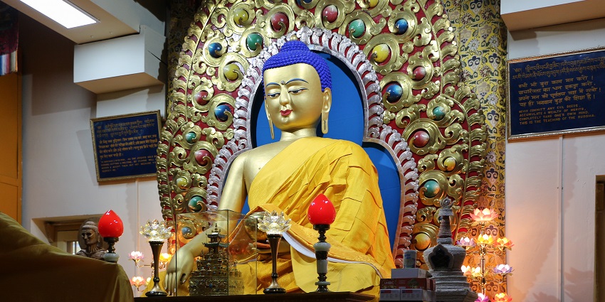 A picture of a Buddha statue in a monastery in Dharamshala