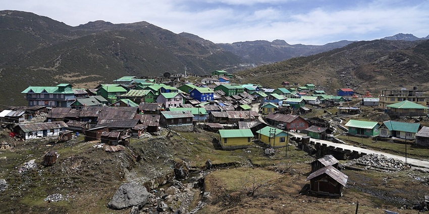 Nathang Valley village nestled on high Himalayan plateau, surrounded by peaks