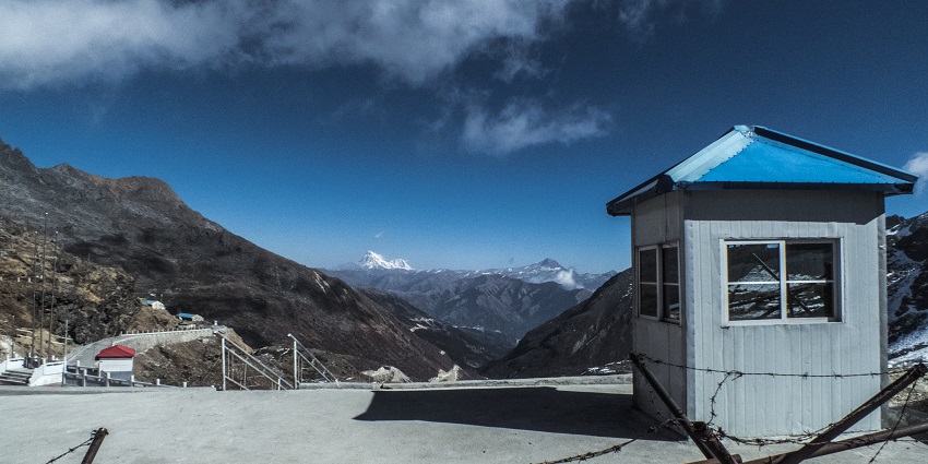 A click of the Chinese checkpost at Nathu La Pass with mountains in the background