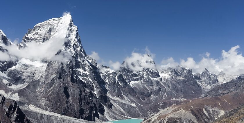 Mesmering snap of the great Himalayas—Snow Laden standing above the clouds