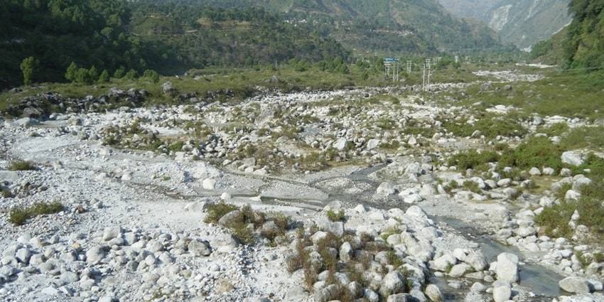 Scenic view of the Neugal stream meandering through the silver rocks at the shore