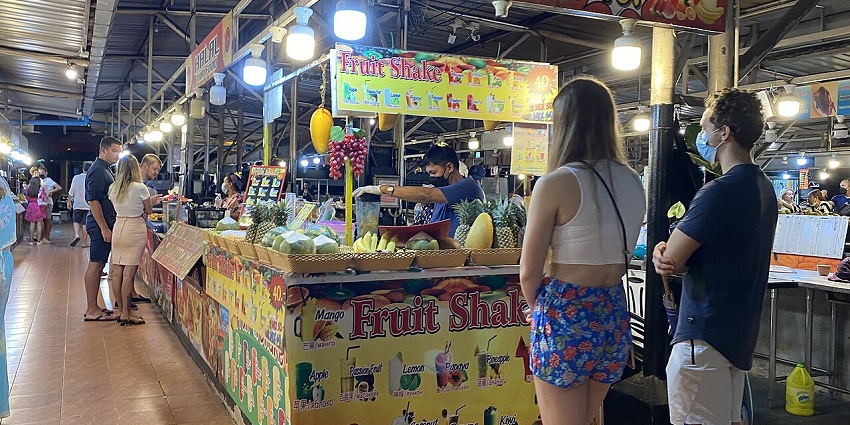 Savour various street dishes like noodles and listen to performances at the night market
