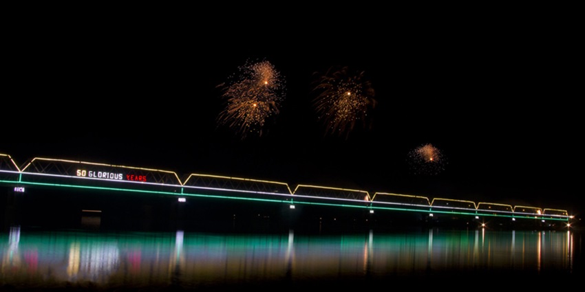Bridge spanning the Brahmaputra River in Guwahati, connecting vibrant urban landscapes.
