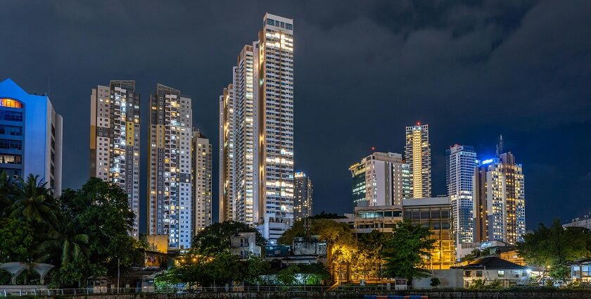 A scenic view of towering buildings with a backdrop of starry sky in the region.