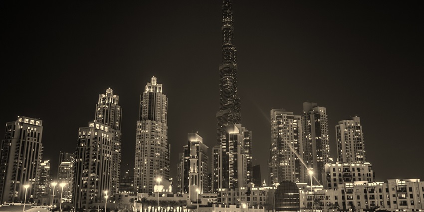 A nighttime expedition showcasing the massive Burj Khalifa and other high-rise buildings