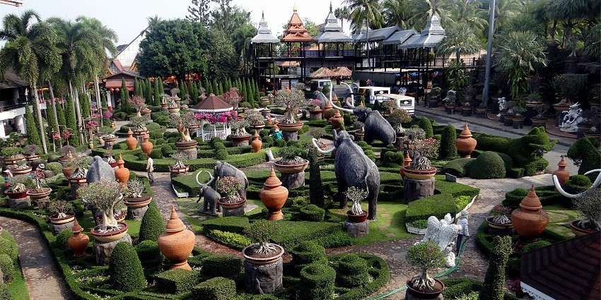 A view of elephant figurines decked in the lush greenery of Nong Nooch Tropical Garden.