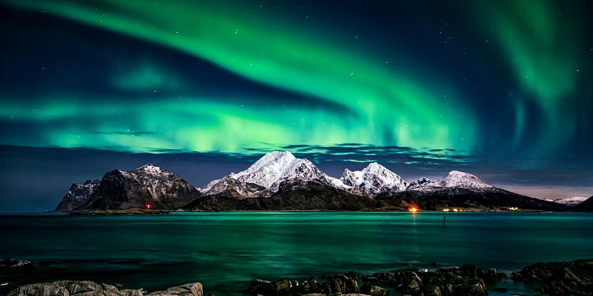 A breathtaking view of the northern lights in Norway, which is a must-see place.