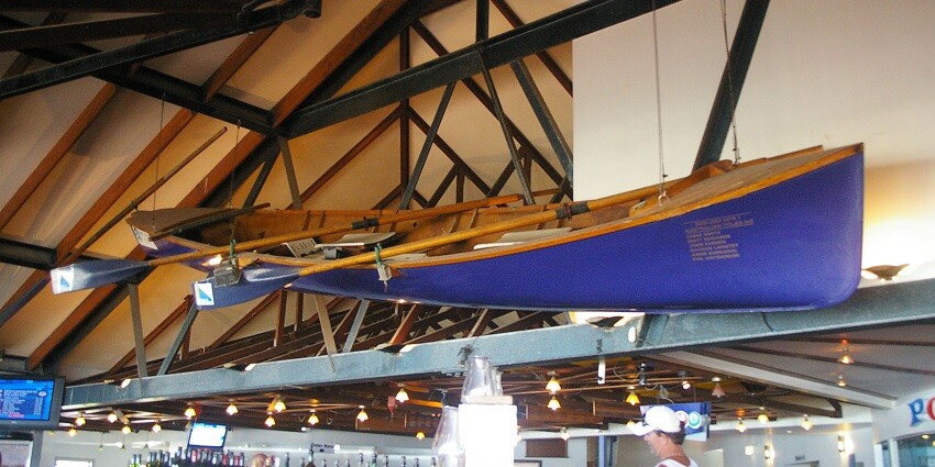 Palm Beach surf life-saving club with a surf boat displayed in the clubhouse bar.