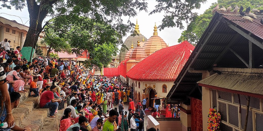 Ambubachi Mela at Kamakhya Temple, bustling with devotees and vibrant festivities.