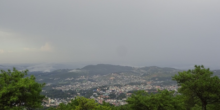 A picture of the Shillong town from another hill showing the greenery and houses