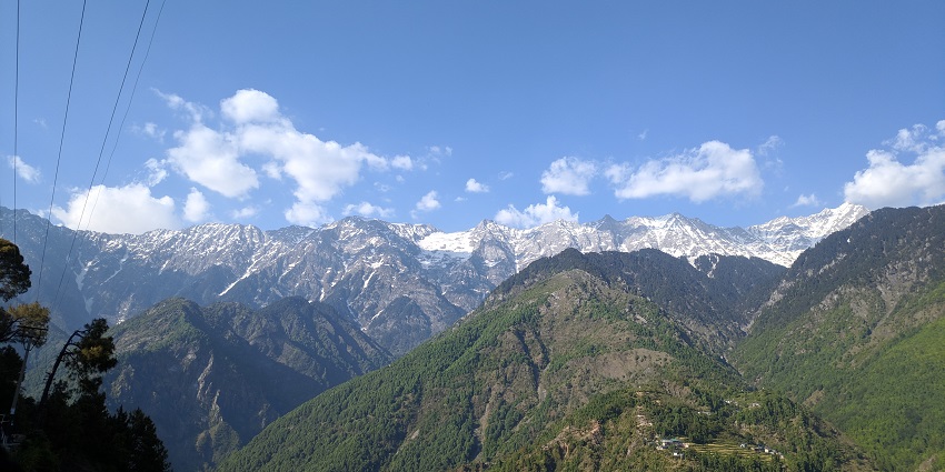 A picture of A mountain range as seen from the town of Dharamshala during daytime