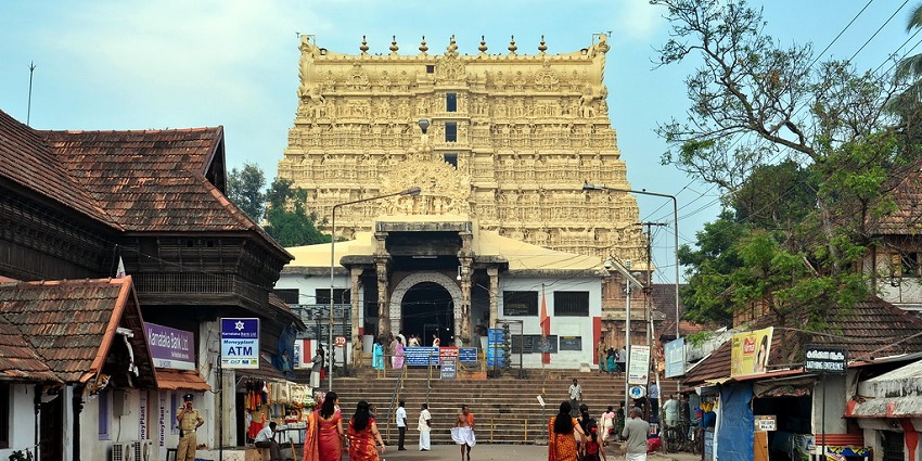 People visiting an old architecture temple to worship