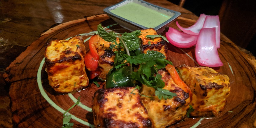 Pahari Paneer Tikka with mint chutney and onion is a perfect combination for food lovers.