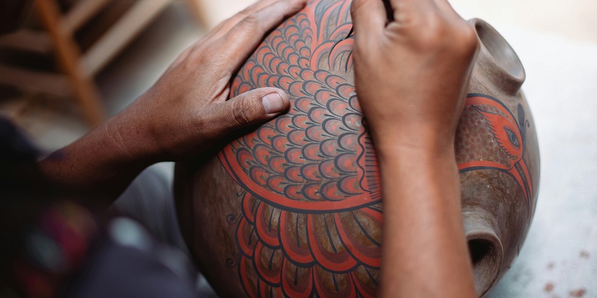 A Man Painting on the jar, explore the craft centre - things to do in Arunachal Pradesh