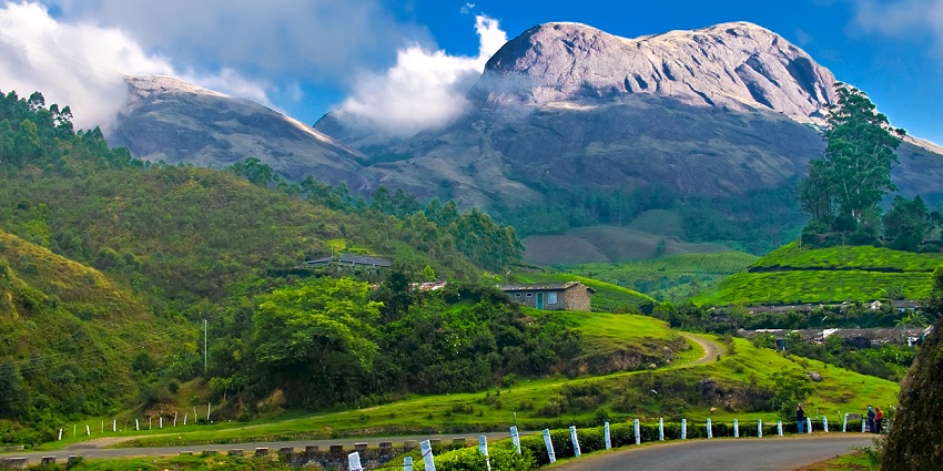 A mesmerising view of Palakkayam Thattu with lush greenery and cloudy skies in background