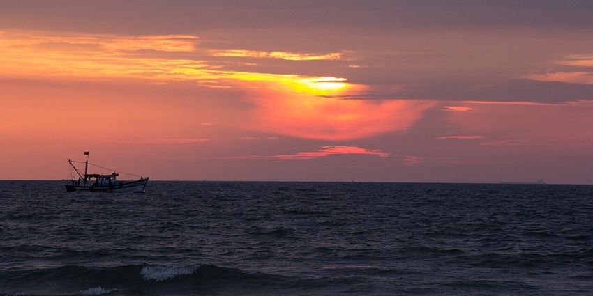 A stunning sunset captured at Panambur Beach, offering a tropical retreat in Kerala.