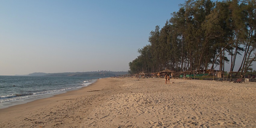 An image of a beach with golden sands and calm shores similar to Pantai Datuk Syed Omar