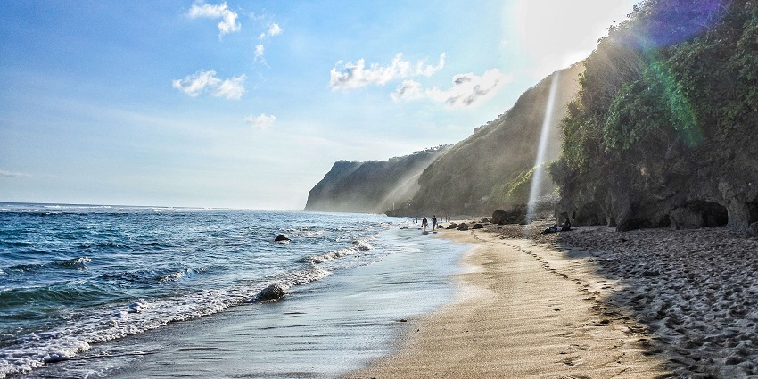 A breathtaking view of a spectacular water body near a rocky island during the daytime.