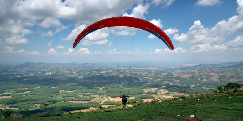Paraglider taking off from a hill top - Pingla Mata is one of the best spots for Paragliding in Jammu