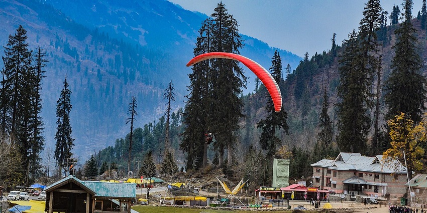 Beautiful Snapshot of Man paragliding in Manali-Best things to do in Manali in June