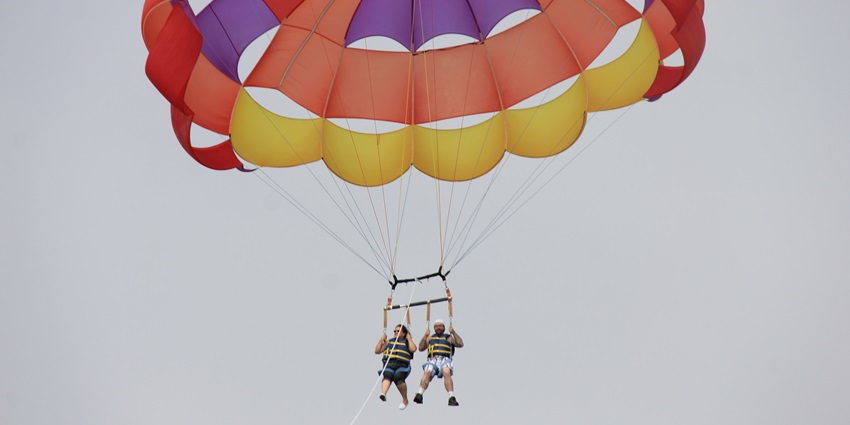 Parasailing off the coast of Jumeirah Beach. One of the best things to do in Dubai