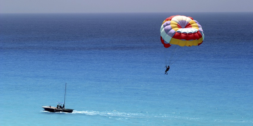 Parasailing is one of the most thrilling water sports in Langkawi. People tied to a boat with a big parachute attached to their backs