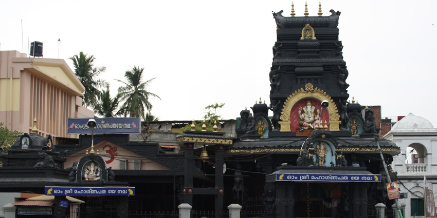 A frontal view of a Ganesha Temple in Trivandrum with devotees gathered in front