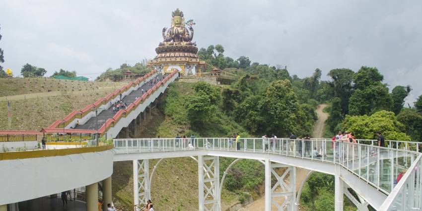 A view of people walking on the Pelling Sky Walk, top spot for paragliding in Pelling.