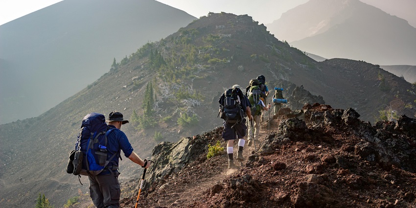 A group of people trekking, himalayan mountains - best things to do in Kufri.