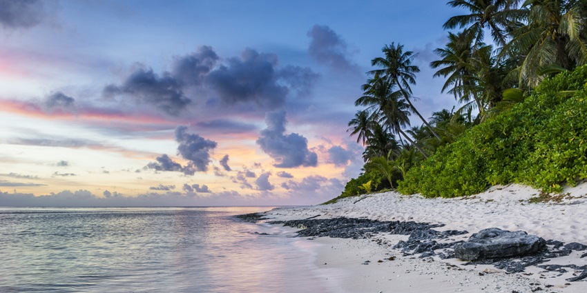 Clouds looming over the serene shores of the Periyambalam Beach as the milky waves crash