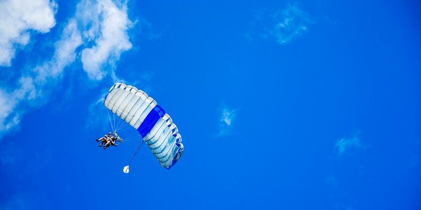A person riding a fan-powered chair, also known as a paramotor - Skydiving Malaysia